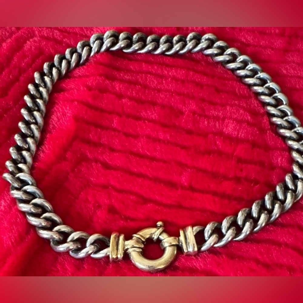 Necklace is a Sterling Silver and 14k Yellow Gold Single Buckle Curb Chain